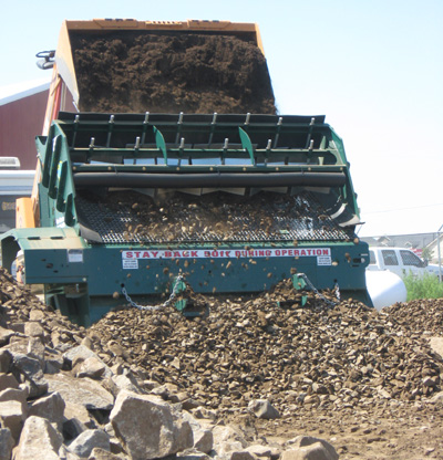 OMH ProScreen PVG-96 being fed by skidsteer